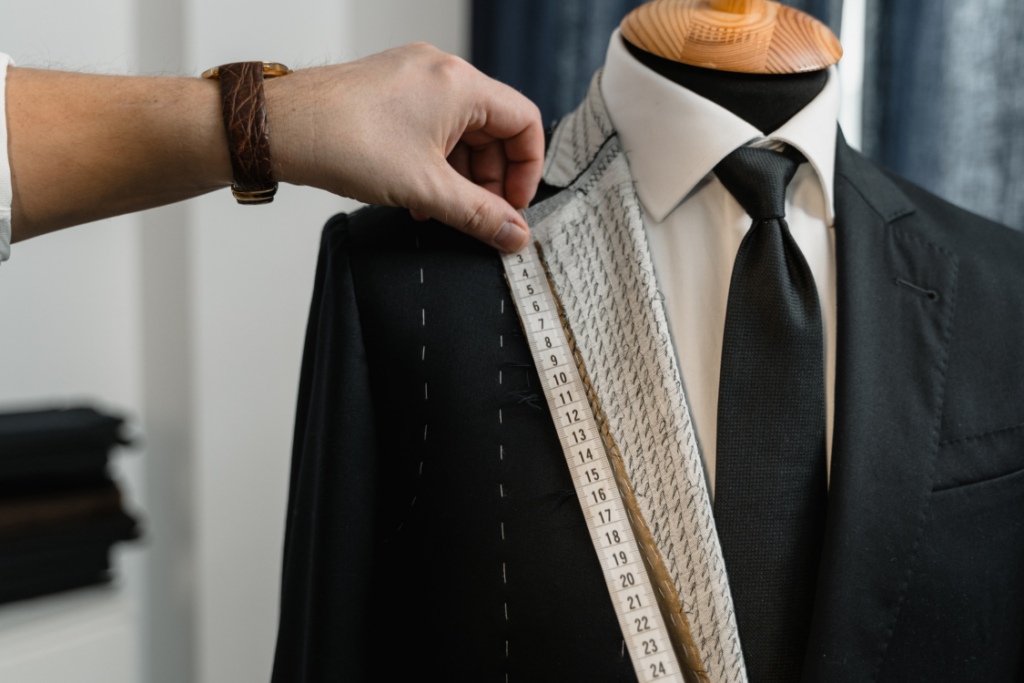 A tailor measures a bespoke suit, symbolising hyper-personalisation and customer-centric banking.